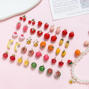 Detailed view of colorful fruit alloy charms and pendants for DIY jewelry crafting