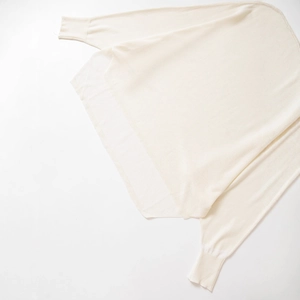Classic cream crewneck knit sweater with ribbed cuffs and soft fine-knit texture