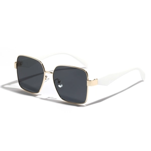 Modern oversized square sunglasses with gold metal frame and contrast white temples