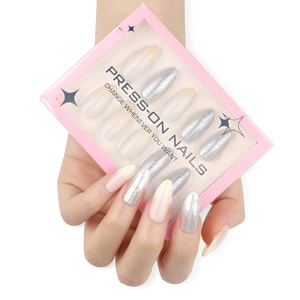 Silver glitter and nude pink gradient press-on nails in long stiletto almond shape