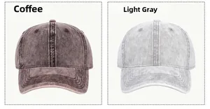 Detail view of washed cotton baseball caps in coffee and light gray vintage denim textures