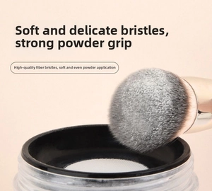 Macro detail of soft synthetic bristles showing high powder-holding capacity on makeup brush