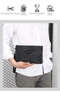 Detailed macro view of black crocodile pattern texture and silver zipper on men's clutch bag