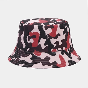 Detail view of the pink camouflage pattern on a double-sided cotton bucket hat