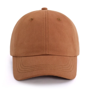 Detailed close-up of dark brown cotton baseball cap with reinforced curved brim stitching
