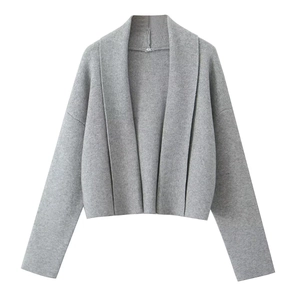 Close-up of a cropped grey knit cardigan with a lapel collar and long sleeves