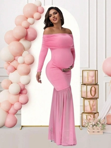 Pink off-shoulder maternity dress with long sleeves and mesh mermaid hem for photoshoot