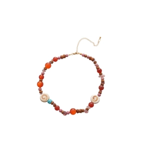 Handmade beaded necklace with natural agate, ceramic beads, wood, and spiral shell charms
