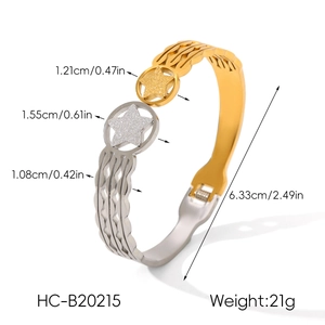 Detail of two-tone stainless steel cuff showing star charms and size measurements