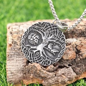 Vintage stainless steel Tree of Life necklace featuring Viking knots and a raven pendant