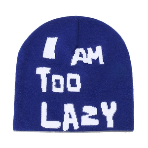 Detailed view of dark blue knit beanie featuring white I am Too LAZY jacquard lettering