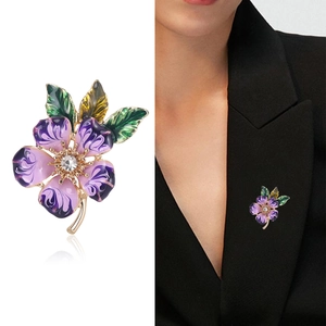 Exquisite purple enamel peach blossom brooch with gold base and crystal on black blazer