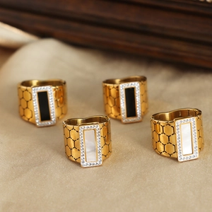 Gold plated honeycomb geometric rings with crystal accents in black and white set