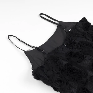Detail of black camisole dress top featuring 3D rose floral appliques and lace trim