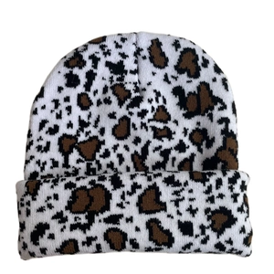 Detailed view of the thick knit texture and leopard pattern on this winter beanie hat