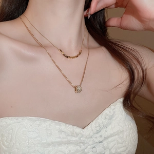 Double-layered 18k gold plated necklace featuring square beads and a zircon pavé pendant