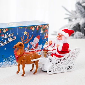 Père Noël animé dans son traîneau à rennes avec coffret cadeau de Noël festif
