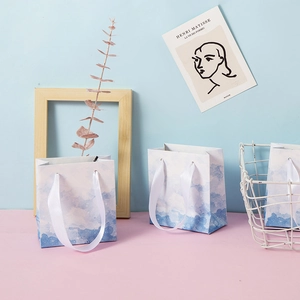 Blue and white gradient jewelry gift bags with silk handles for rings and necklaces