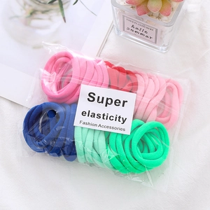 Detail of high elasticity seamless hair ties in vibrant colors with clear packaging