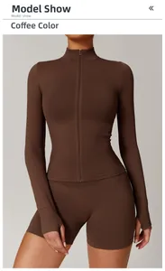 Detail view of coffee brown sports set with high collar zipper jacket and thumb hole sleeves