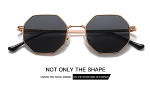 Detail of vintage octagonal metal frame sunglasses with marketing text on a white background