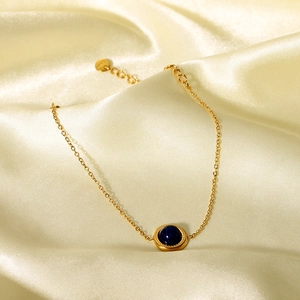 French vintage 14K gold plated stainless steel bracelet with a deep blue gemstone