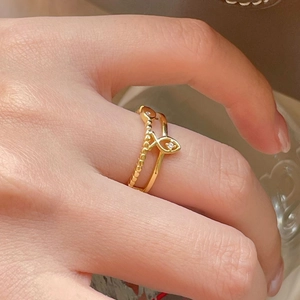 Elegant gold fish-shaped S925 silver ring with micro-diamonds on model hand