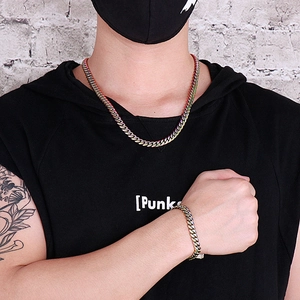 Rainbow plated stainless steel Cuban chain necklace and bracelet set on male model