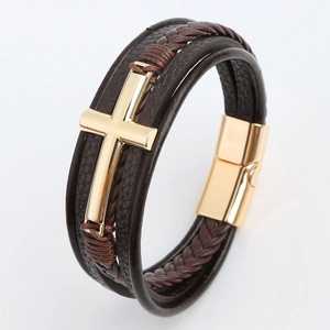 Detail of multi-layer braided leather bracelet with golden alloy cross and magnetic clasp