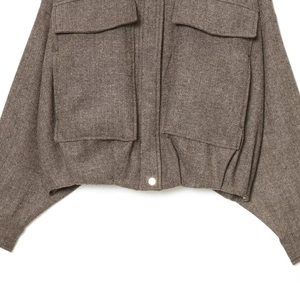 Women's dark brown herringbone wool jacket with large patch pockets and snap button detail