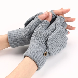 Detail of grey knitted flip-top fingerless gloves with secure button and striped texture