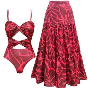 Two-piece floral cut-out swimsuit set with matching tiered maxi skirt for beach vacation