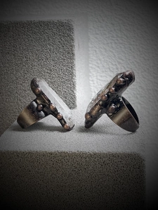 Macro shot of vintage bronze rings with large raw hexagonal white crystals
