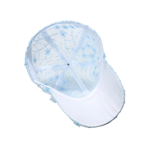 Detailed inner view of breathable light blue mesh baseball cap with floral sequins