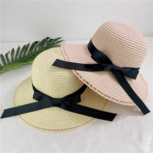Women's straw sun hats with lace trim and black bow ties in beige and pink styles