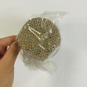 Detailed view of mini Christmas tree base wrapped in rustic natural burlap fabric