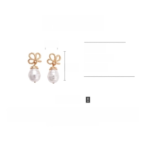 Detail showing vintage gold bow and pearl drop earrings with 4.5cm height specification