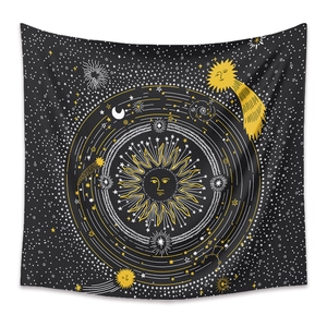 Detailed pattern of celestial tapestry with sun, moon and golden stars on black fabric