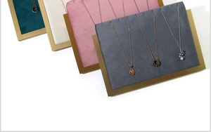 Detail view of colorful velvet jewelry display trays with elegant golden frames