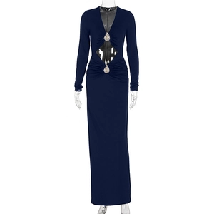 Close-up of navy blue dress with waist cut-out, ruching and silver rhinestone buckle