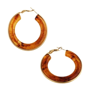 Exaggerated amber tortoise shell hoop earrings with gold metal clasp on white background