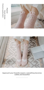 Close-up of pink fuzzy coral fleece socks with 3D animal ears and white heart pattern