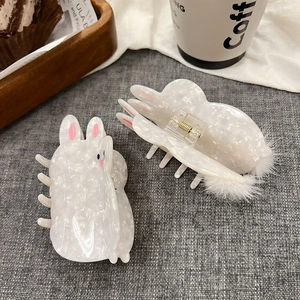 Cute pearl white rabbit hair claw clip with plush ball detail for women hairstyles