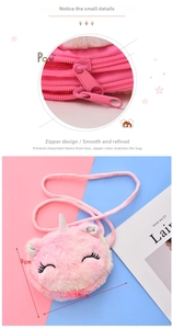 Detailed macro view of pink plush unicorn purse with zipper and 18cm x 9cm size label