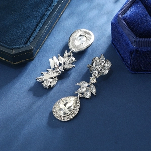 Elegant silver bridal clip-on earrings with drop-shaped crystals on navy velvet base