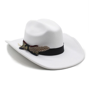 Close-up of white felt cowboy hat with vintage bow and natural brown feather detail