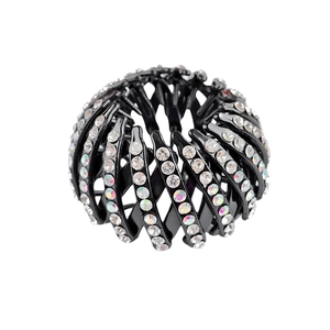 Detail of expandable black bird nest hair clip with sparkling rhinestones for buns
