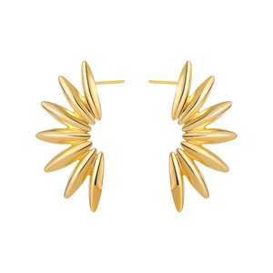 Detail of 18K gold petal earrings with irregular metallic leaf texture and sunburst design