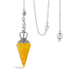 Macro shot of citrine crystal hexagonal pendulum with silver crown cap and chain