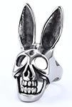 Macro detail of a gothic retro bunny skull ring in oxidized stainless steel finish